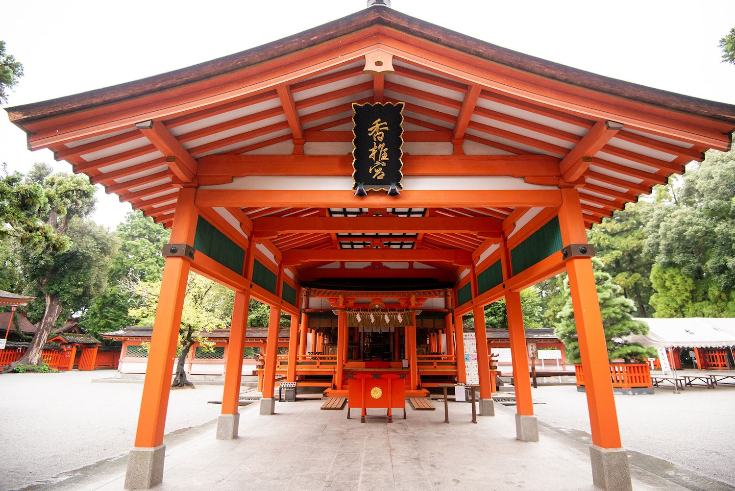 Vermilion worship hall of Kashiigu Shrine on a clear day