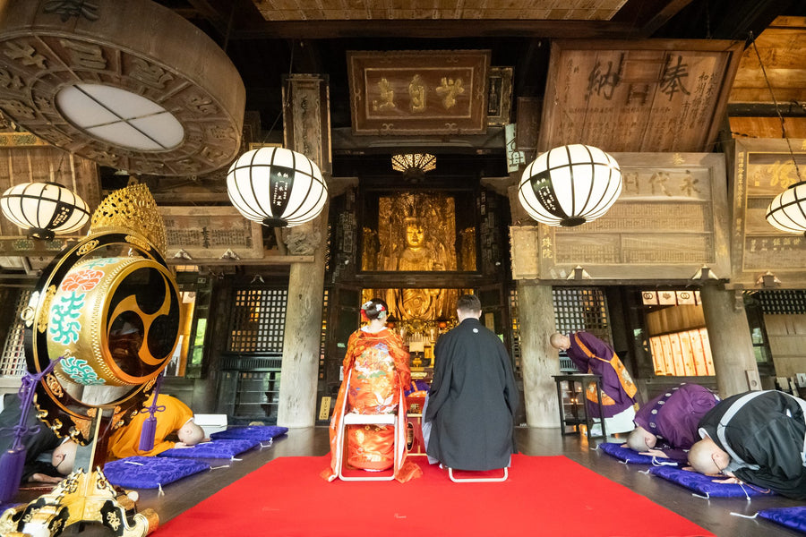 The Buddhist wedding ceremony in the main hall of Hasedera, a National Treasure, monks seated in rows
