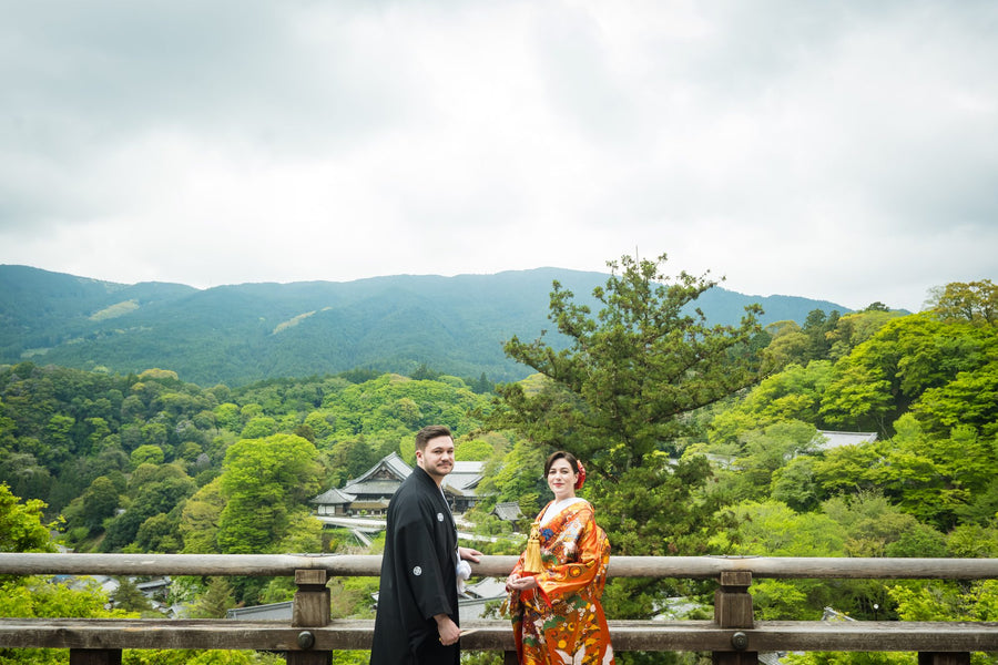 The couple at the stage railing, the mountains of Nara beyond